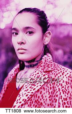 Stock Photo - young woman in 
fake fur coat 
with tattoo on 
her chest. fotosearch 
- search stock 
photos, pictures, 
images, and photo 
clipart