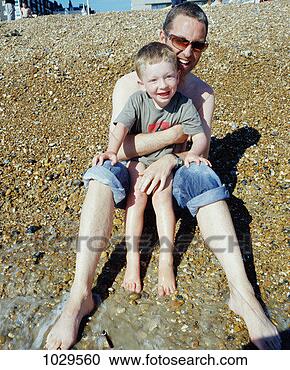 Stock Photography - father and son 
playing in brighton 
beach,  brighton 
- west sussex 
-. fotosearch 
- search stock 
photos, pictures, 
images, and photo 
clipart