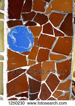 Stock Photography - a detail of a 
mosaic wall in 
gaudi's park gã¼ell, 
barcelona, spain. 
fotosearch - search 
stock photos, 
pictures, images, 
and photo clipart