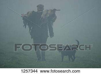 Stock Photo - a gun dog with 
his master at 
a pheasant shoot, 
england. fotosearch 
- search stock 
photos, pictures, 
images, and photo 
clipart