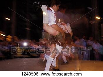 Stock Photo - traditional tyrolean 
dancers performing 
on a stage to 
an audience. fotosearch 
- search stock 
photos, pictures, 
images, and photo 
clipart