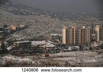 Stock Photo - a view across 
the suburbs of 
the city with 
a cemetery in 
the. fotosearch 
- search stock 
photos, pictures, 
images, and photo 
clipart