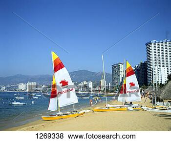 Stock Photo - sailing dinghies 
on the beach at 
acapulco, mexico. 
fotosearch - search 
stock photos, 
pictures, images, 
and photo clipart