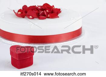 Stock Photo - heart box by cake. 
fotosearch - search 
stock photos, 
pictures, images, 
and photo clipart