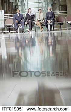 Stock Photography - contemporary shot 
four business 
people sitting 
in a line. fotosearch 
- search stock 
photos, pictures, 
images, and photo 
clipart