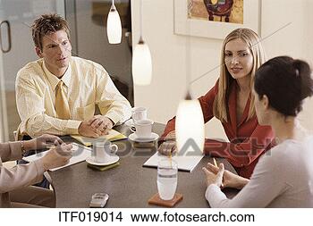 Stock Photo - three business 
people having 
a friendly meeting. 
fotosearch - search 
stock photos, 
pictures, images, 
and photo clipart