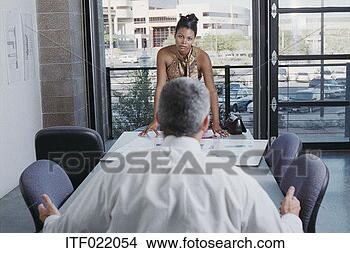 Stock Photo - businesswoman 
having an intense 
meeting. fotosearch 
- search stock 
photos, pictures, 
images, and photo 
clipart