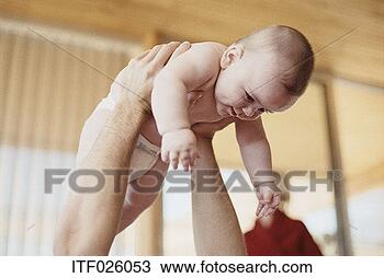 Stock Photo - portrait of a 
baby being held 
in the air. fotosearch 
- search stock 
photos, pictures, 
images, and photo 
clipart