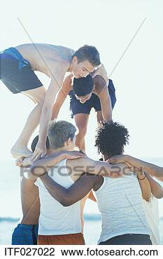 Stock Photo - group of teenage 
boys doing acrobatics. 
fotosearch - search 
stock photos, 
pictures, images, 
and photo clipart
