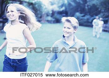 Stock Image - portrait of a 
teenage boy and 
girl running. 
fotosearch - search 
stock photos, 
pictures, images, 
and photo clipart