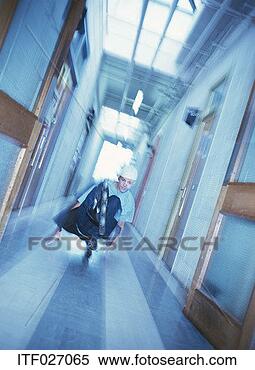 Stock Image - teenage boy skating 
in a corridor. 
fotosearch - search 
stock photos, 
pictures, images, 
and photo clipart