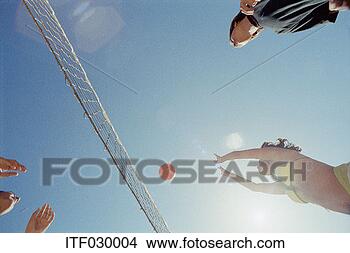 Stock Photo - young people playing 
volleyball. fotosearch 
- search stock 
photos, pictures, 
images, and photo 
clipart