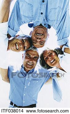 Stock Photo - contemporary portrait 
of four mature 
people with their 
heads together. 
fotosearch - search 
stock photos, 
pictures, images, 
and photo clipart