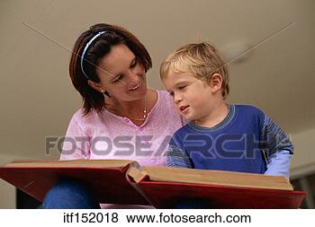 Stock Photo - woman and young 
boy reading large 
book. fotosearch 
- search stock 
photos, pictures, 
images, and photo 
clipart