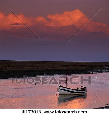 Stock Photo - boat on lake during 
sunset. fotosearch 
- search stock 
photos, pictures, 
images, and photo 
clipart