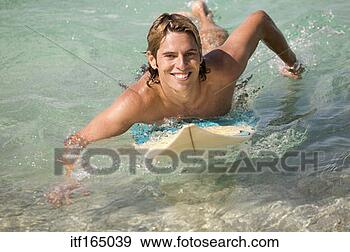 Stock Photograph - man surfing. fotosearch 
- search stock 
photos, pictures, 
images, and photo 
clipart