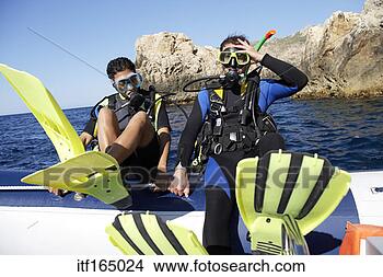 Stock Photo - scuba divers about 
to enter water. 
fotosearch - search 
stock photos, 
pictures, images, 
and photo clipart