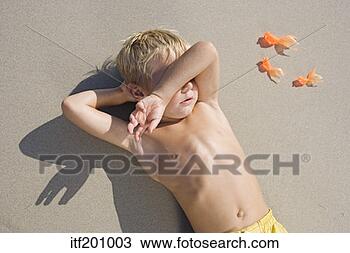 Stock Photo - high angle view 
of boy lying down 
and covering eyes. 
fotosearch - search 
stock photos, 
pictures, images, 
and photo clipart