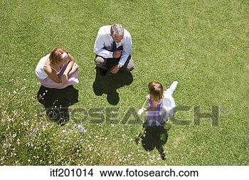 Stock Photo - high angle view 
of parents with 
daughter in fairy 
costume. fotosearch 
- search stock 
photos, pictures, 
images, and photo 
clipart