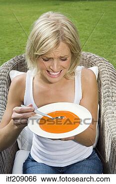 Stock Photo - woman eating bowl 
of soup. fotosearch 
- search stock 
photos, pictures, 
images, and photo 
clipart