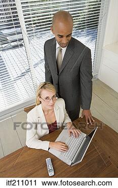Stock Photography - businesspeople 
using laptop. 
fotosearch - search 
stock photos, 
pictures, images, 
and photo clipart