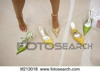 Stock Photo - woman trying on 
shoes. fotosearch 
- search stock 
photos, pictures, 
images, and photo 
clipart
