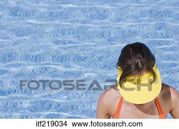 Stock Photo - woman looking 
down with visor 
on. fotosearch 
- search stock 
photos, pictures, 
images, and photo 
clipart