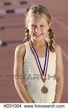 Stock Photo - smiling girl wearing 
medal. fotosearch 
- search stock 
photos, pictures, 
images, and photo 
clipart