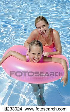 Stock Photo - mother with daughter 
using flotation 
device in pool. 
fotosearch - search 
stock photos, 
pictures, images, 
and photo clipart