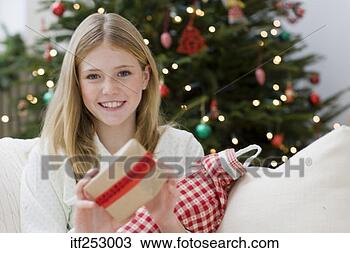 Stock Photo - smiling girl with 
stocking and present. 
fotosearch - search 
stock photos, 
pictures, images, 
and photo clipart
