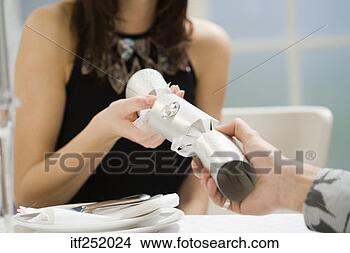 Stock Photo - woman and man 
holding christmas 
cracker. fotosearch 
- search stock 
photos, pictures, 
images, and photo 
clipart