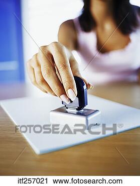 Stock Photography - woman with stamp. 
fotosearch - search 
stock photos, 
pictures, images, 
and photo clipart