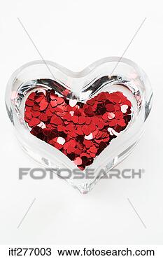 Stock Photo - glass heart with 
confetti. fotosearch 
- search stock 
photos, pictures, 
images, and photo 
clipart