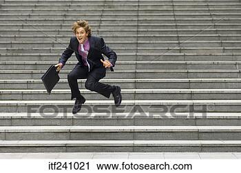 Arquivo de Fotografia - homem negócios, 
 dançar. fotosearch 
- busca de fotos, 
imagens e clipart