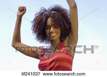 Picture - woman smiling 
with arms overhead. 
fotosearch - search 
stock photos, 
pictures, images, 
and photo clipart