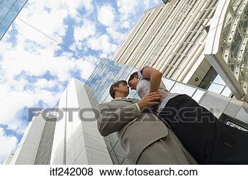 Stock Photo - couple embracing 
in city. fotosearch 
- search stock 
photos, pictures, 
images, and photo 
clipart