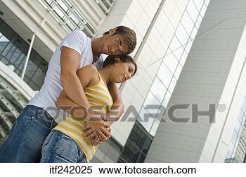 Stock Image - couple embracing 
outdoors. fotosearch 
- search stock 
photos, pictures, 
images, and photo 
clipart