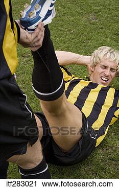 Stock Photography - soccer player 
stretching. fotosearch 
- search stock 
photos, pictures, 
images, and photo 
clipart