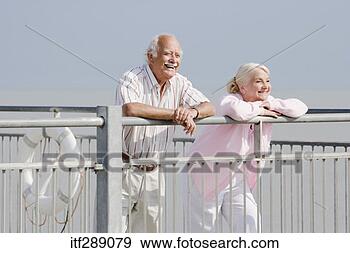 Stock Photograph - smiling couple 
on pier. fotosearch 
- search stock 
photos, pictures, 
images, and photo 
clipart