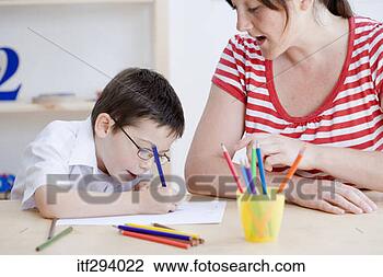 Stock Photo - boy drawing picture 
at school. fotosearch 
- search stock 
photos, pictures, 
images, and photo 
clipart