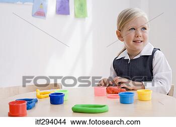 Stock Photo - girl playing with 
molding clay. 
fotosearch - search 
stock photos, 
pictures, images, 
and photo clipart