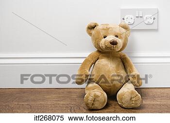 Stock Image - teddy bear and 
childproof outlet. 
fotosearch - search 
stock photos, 
pictures, images, 
and photo clipart