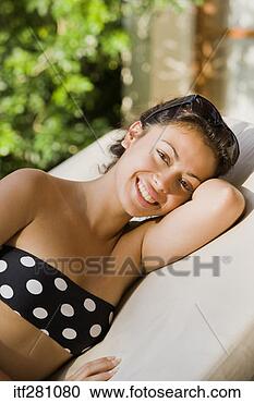 Stock Photography - portrait of woman 
sunbathing. fotosearch 
- search stock 
photos, pictures, 
images, and photo 
clipart