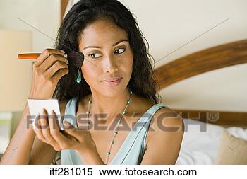 Stock Image - woman applying 
make-up. fotosearch 
- search stock 
photos, pictures, 
images, and photo 
clipart