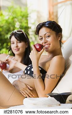 Stock Photo - woman in bikini 
holding apple. 
fotosearch - search 
stock photos, 
pictures, images, 
and photo clipart