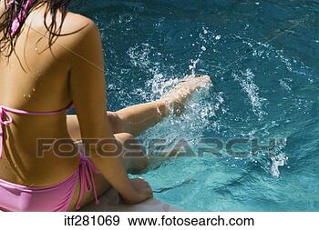 Stock Photograph - woman dipping 
legs in swimming 
pool. fotosearch 
- search stock 
photos, pictures, 
images, and photo 
clipart