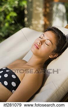 Stock Photograph - woman sunbathing. 
fotosearch - search 
stock photos, 
pictures, images, 
and photo clipart