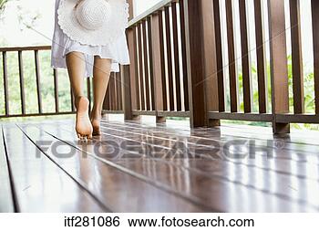 Stock Photo - woman walking 
on deck. fotosearch 
- search stock 
photos, pictures, 
images, and photo 
clipart