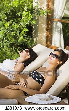 Stock Photo - women sunbathing. 
fotosearch - search 
stock photos, 
pictures, images, 
and photo clipart