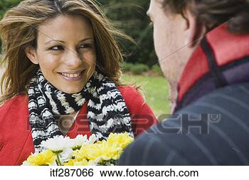 Stock Photo - couple with flowers. 
fotosearch - search 
stock photos, 
pictures, images, 
and photo clipart